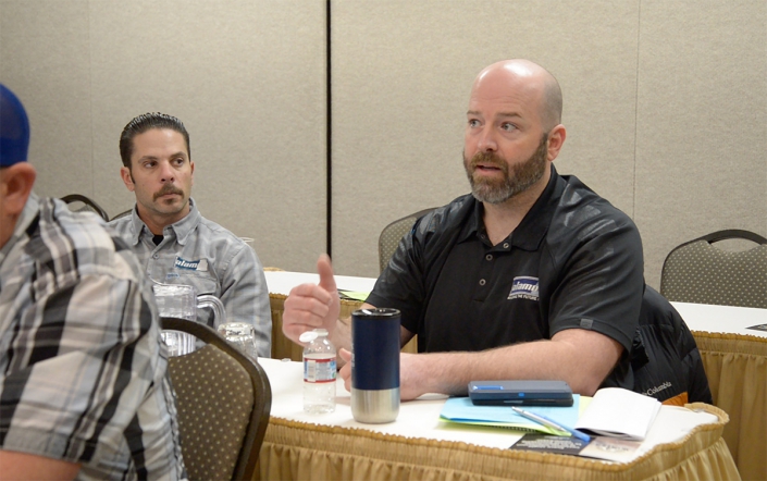 Wireless Field Supervisor Chad Scarcelli (L) listens to Electrical Supervisor Justin Pratt during the 2023 Winter Meetings.